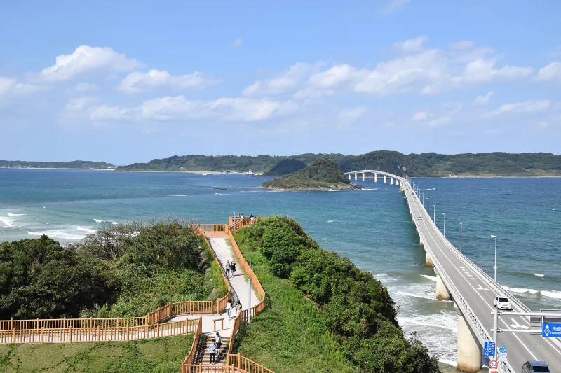 View from the mainland viewpoint with wooden walkways and Tsunoshima Bridge stretching out to the island