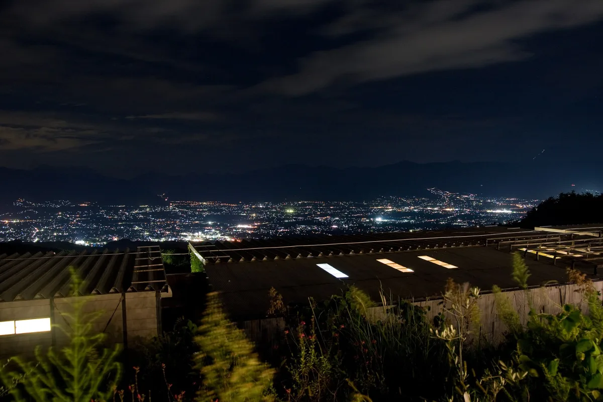 Night view of the city lights of the Kofu Basin seen from Hottarakashi Onsen